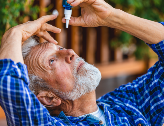 older male in a blue shirt instilling ILEVRO